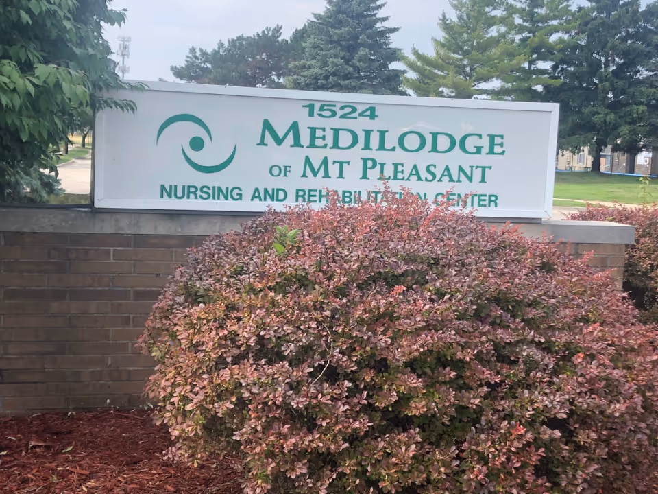 Sign for Medilodge of Mt Pleasant Nursing and Rehabilitation Center in front.