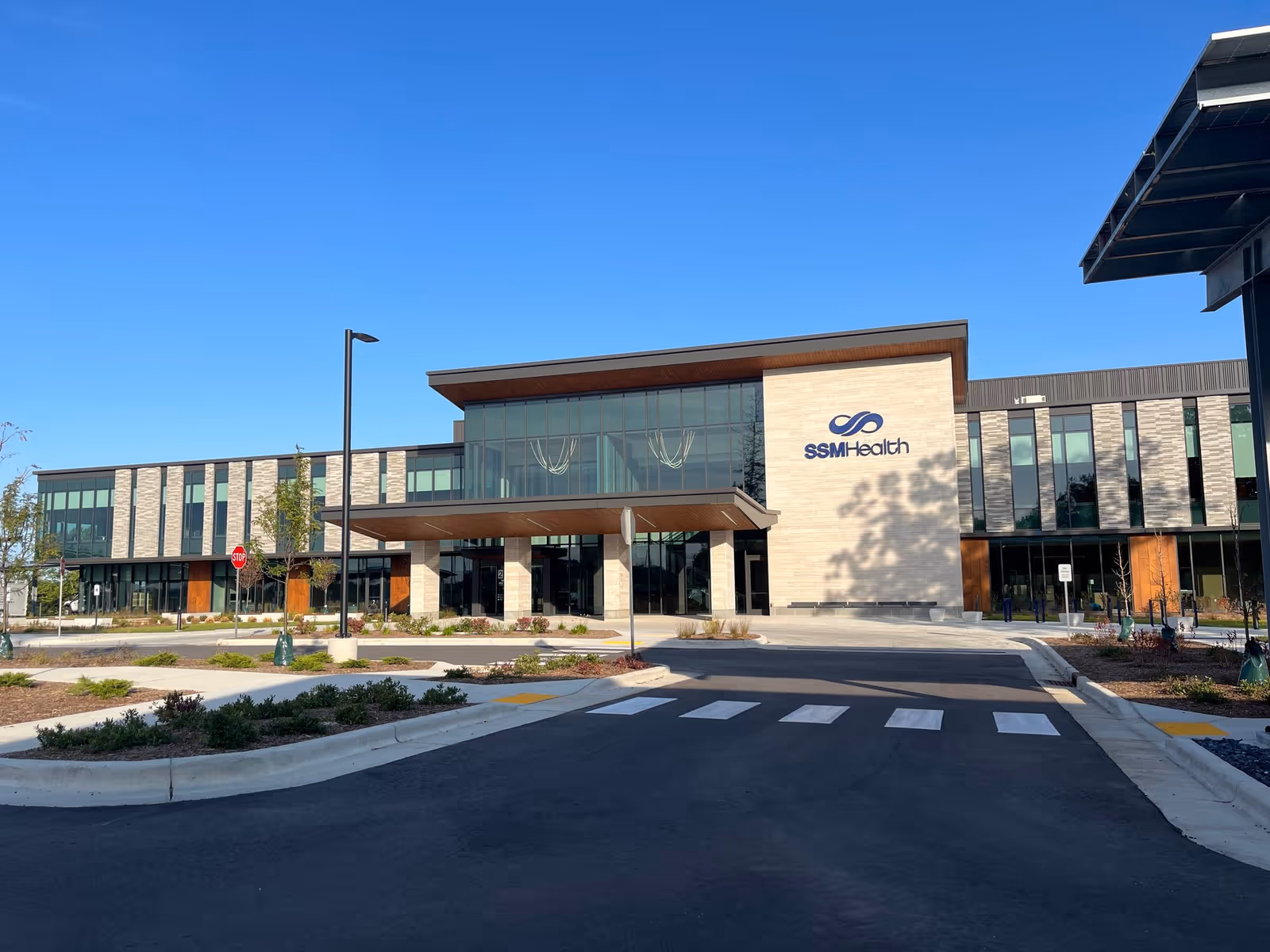 Modern SSM Health Outpatient Center exterior with glass façade and clear blue sky
