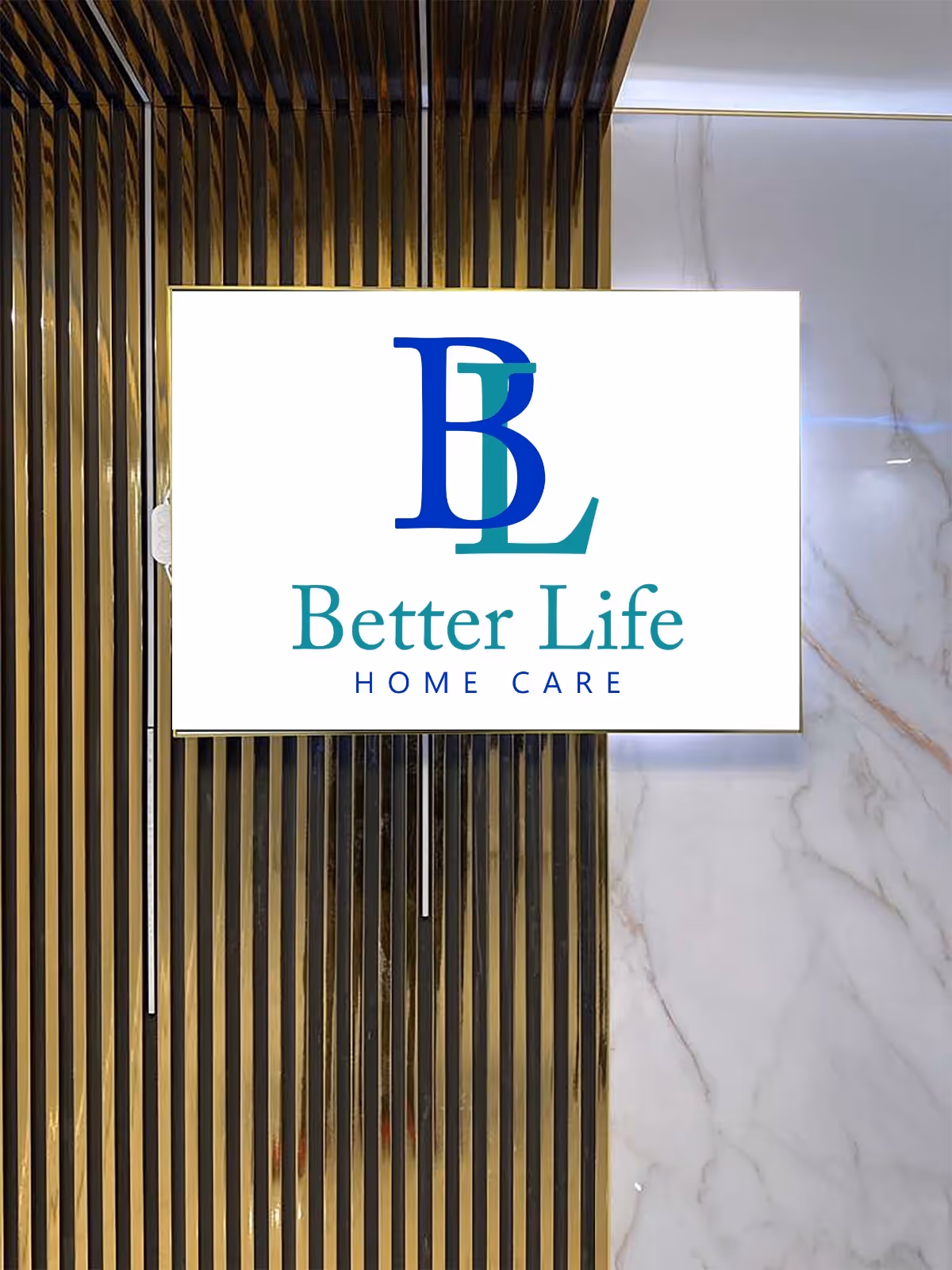 Indoor lobby area featuring a well-lit Better Life Home Care sign on wood panel wall.