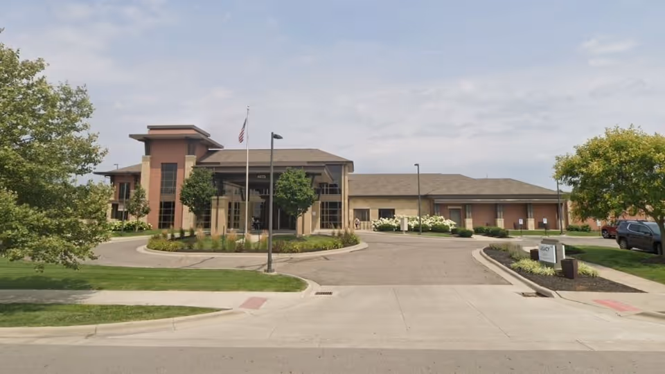 Front view of Legacy Dublin senior living facility with entrance and landscaping.
