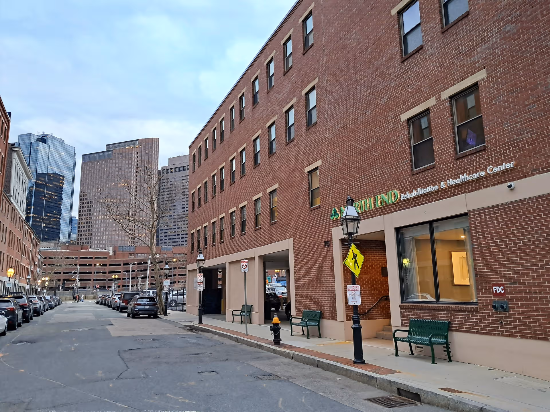 Brick exterior of North End Rehabilitation and Healthcare Center on a city street.