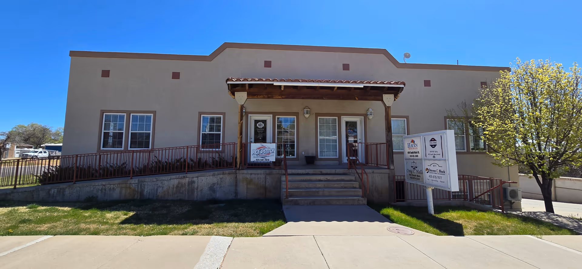 Front exterior of Haven Specialty Home Care Utah building with steps and signs.