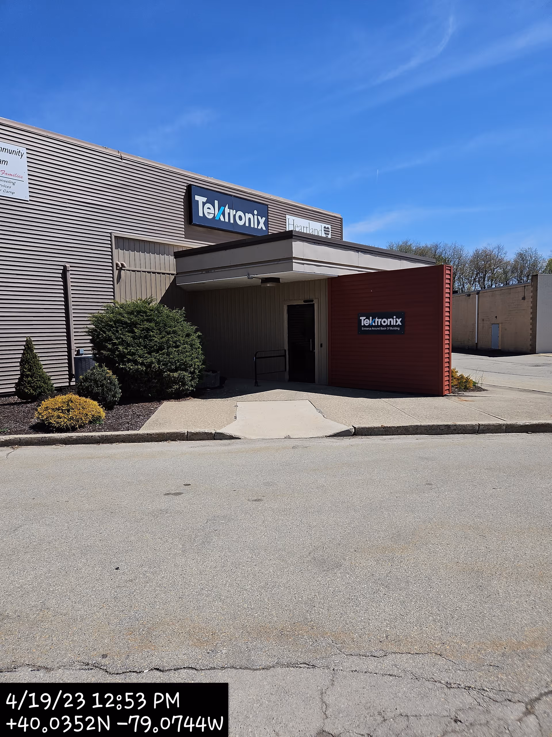 Exterior front of Heartland Hospice building with signage and entrance canopy.
