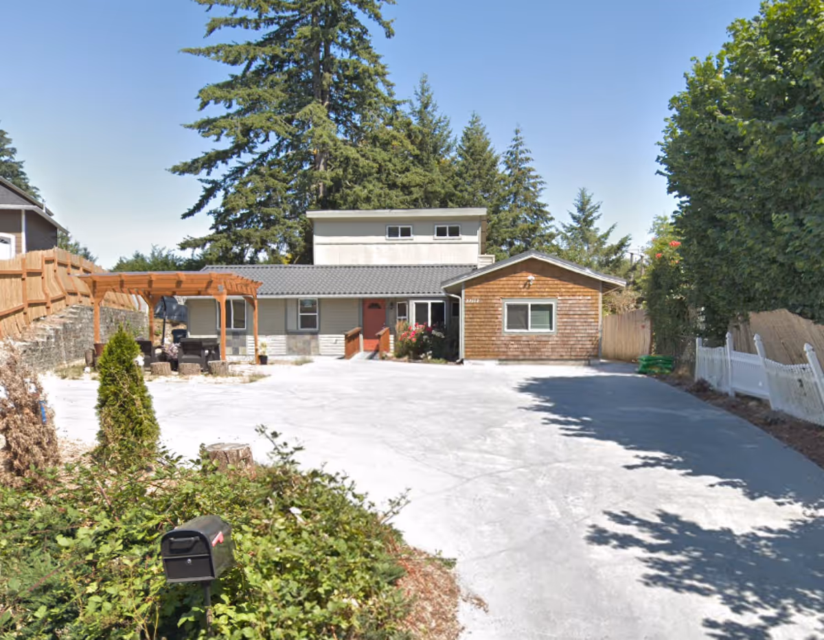 Exterior view of Best Comfort Adult Family Home LLC with a wide paved driveway