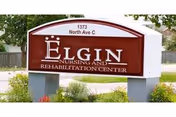 Front sign for Elgin Nursing and Rehabilitation Center with landscaping.