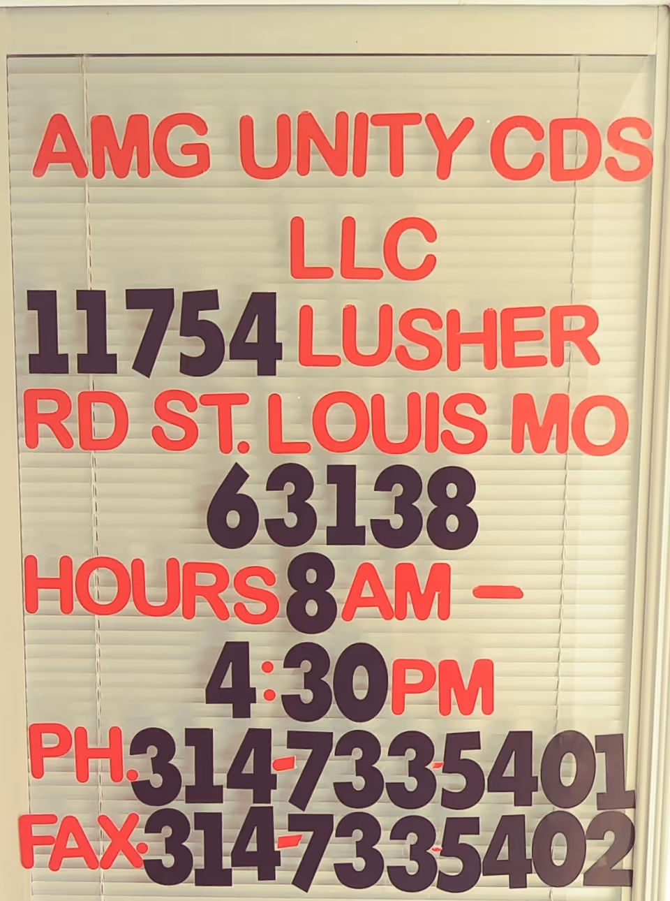 Window sign for AMG UNITY CDS LLC with address and hours