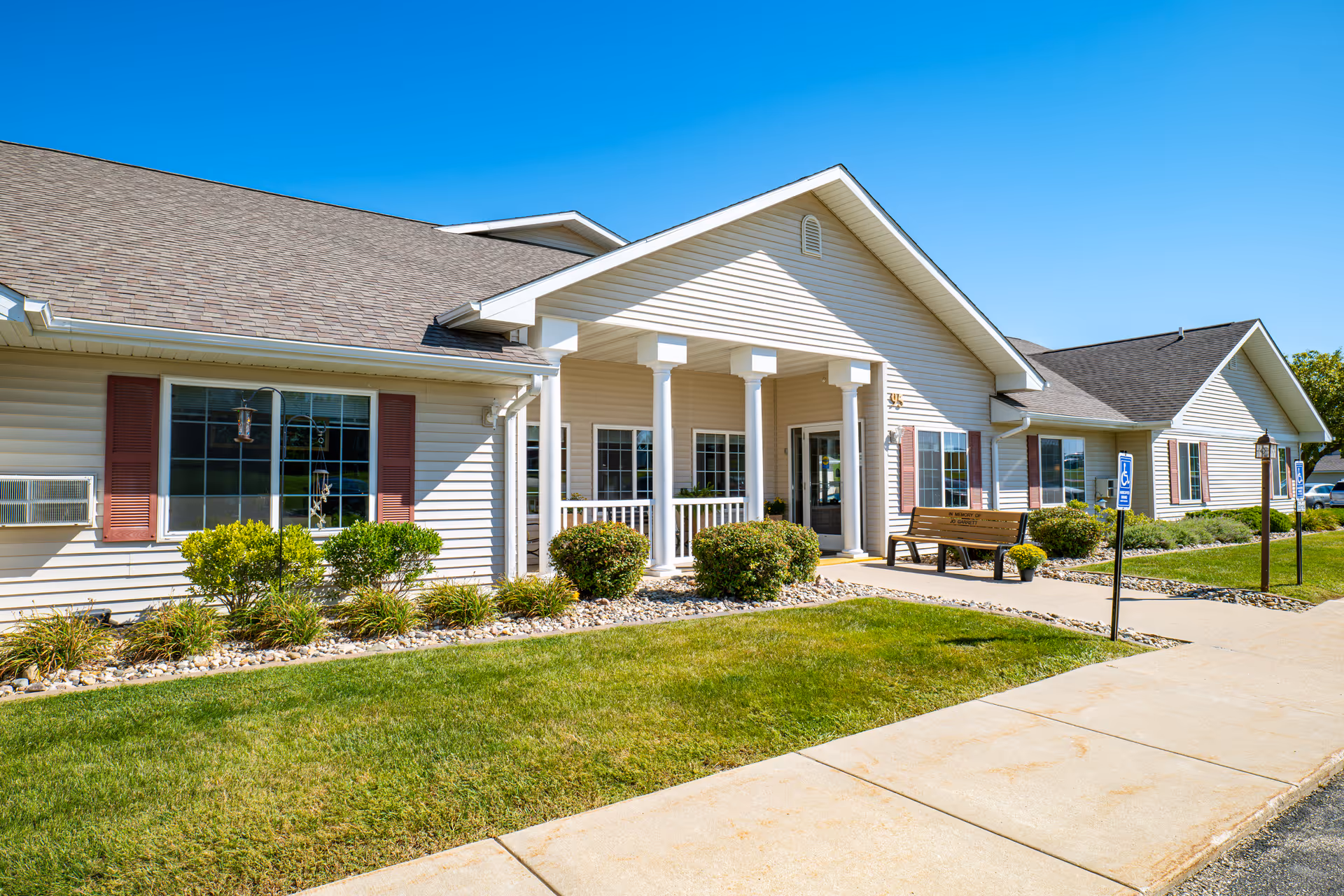 Exterior of Landings of Kaukauna, a single-story senior living facility with a covered entrance.
