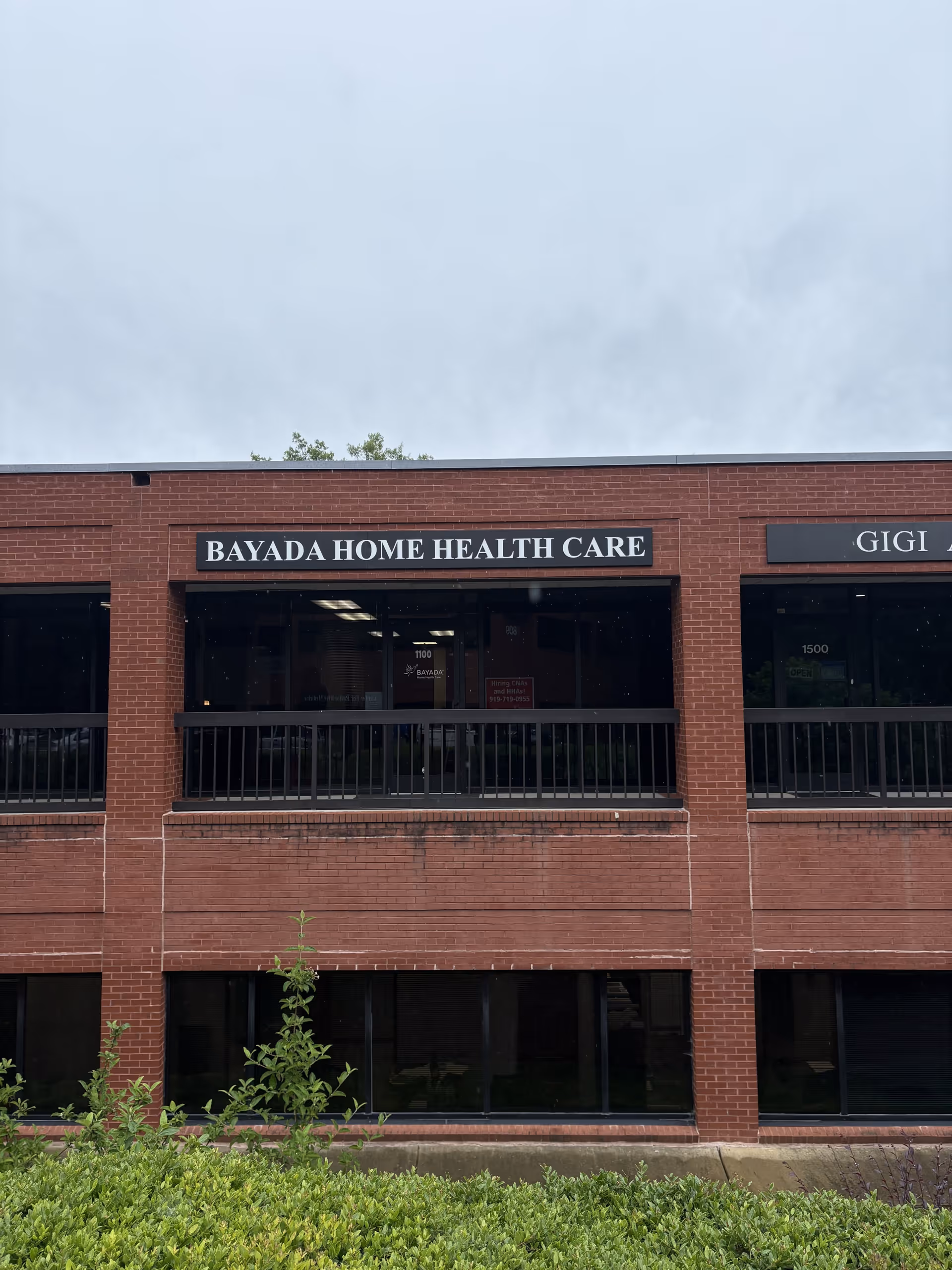 Brick building facade with BAYADA Home Health Care sign above windows.