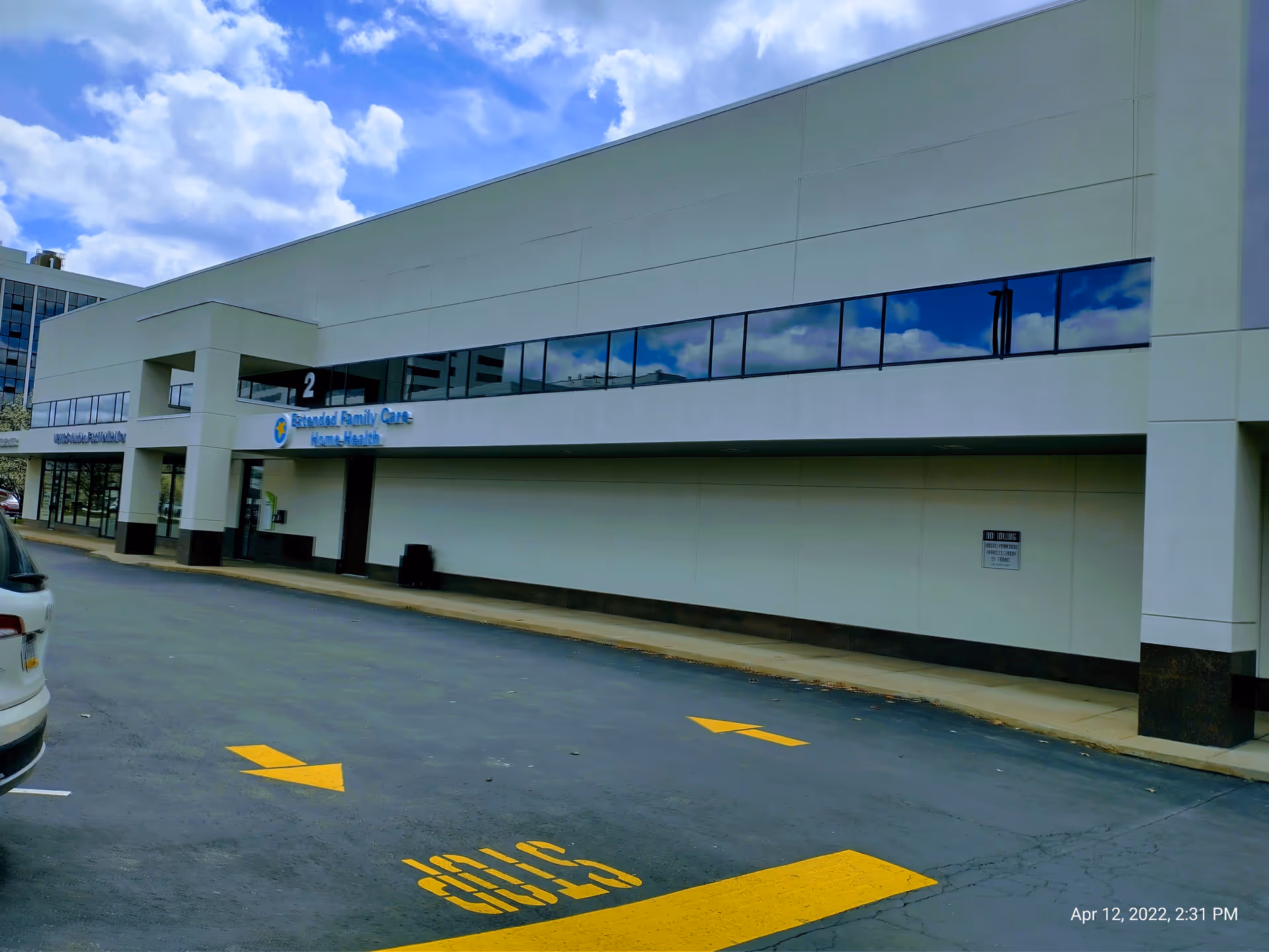 Exterior view of Extended Family Care Pittsburgh, a modern senior care facility with reflective windows.