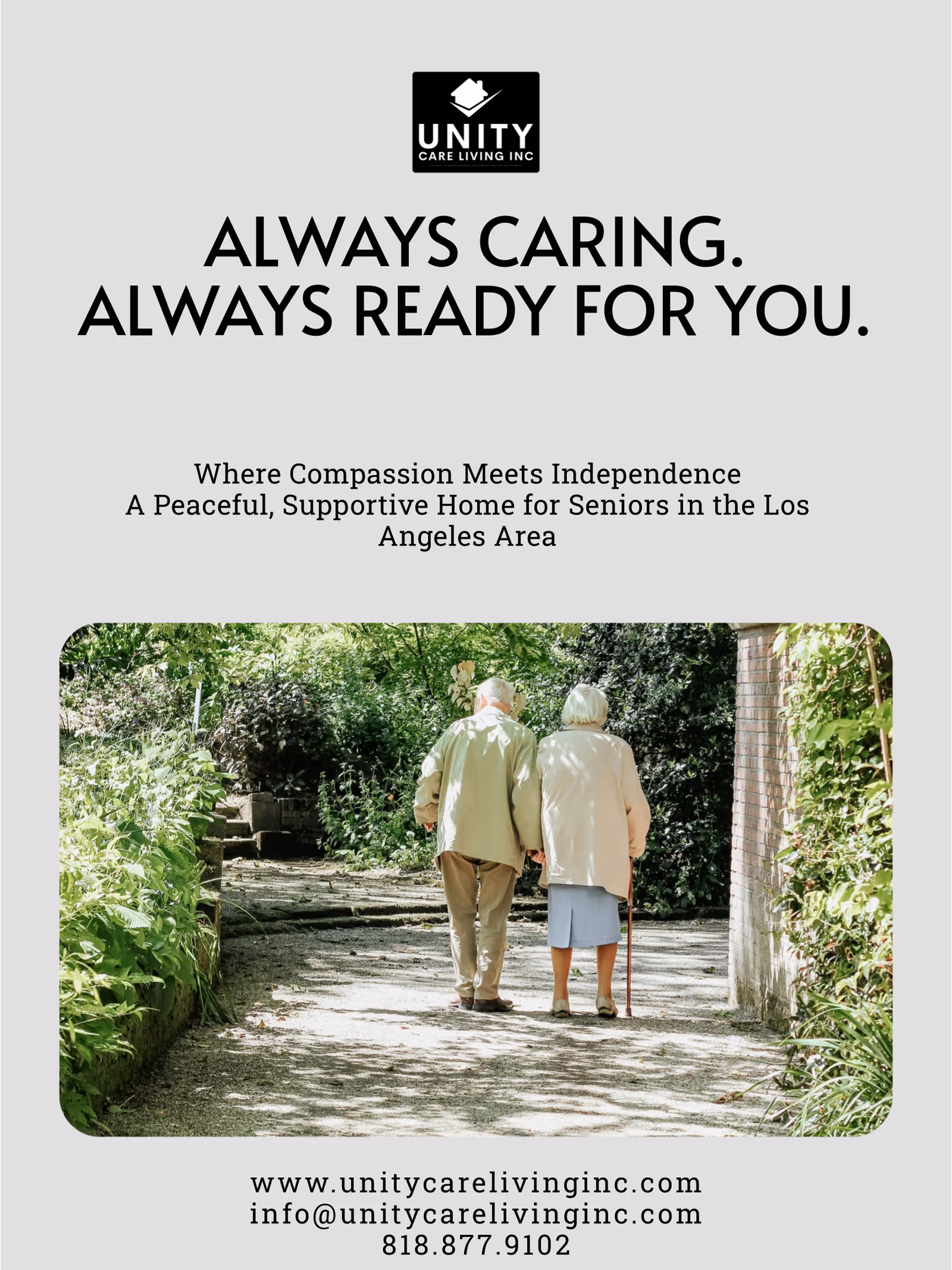 Two elderly residents walk along a sunlit garden path at Unity Care Living Inc.