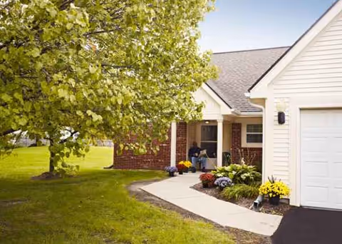 Front view of Baldwin House Hazel Park Senior Living with walkway and porch