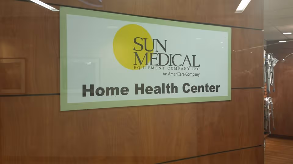Indoor wall with Sun Medical Equipment Company Home Health Center sign.