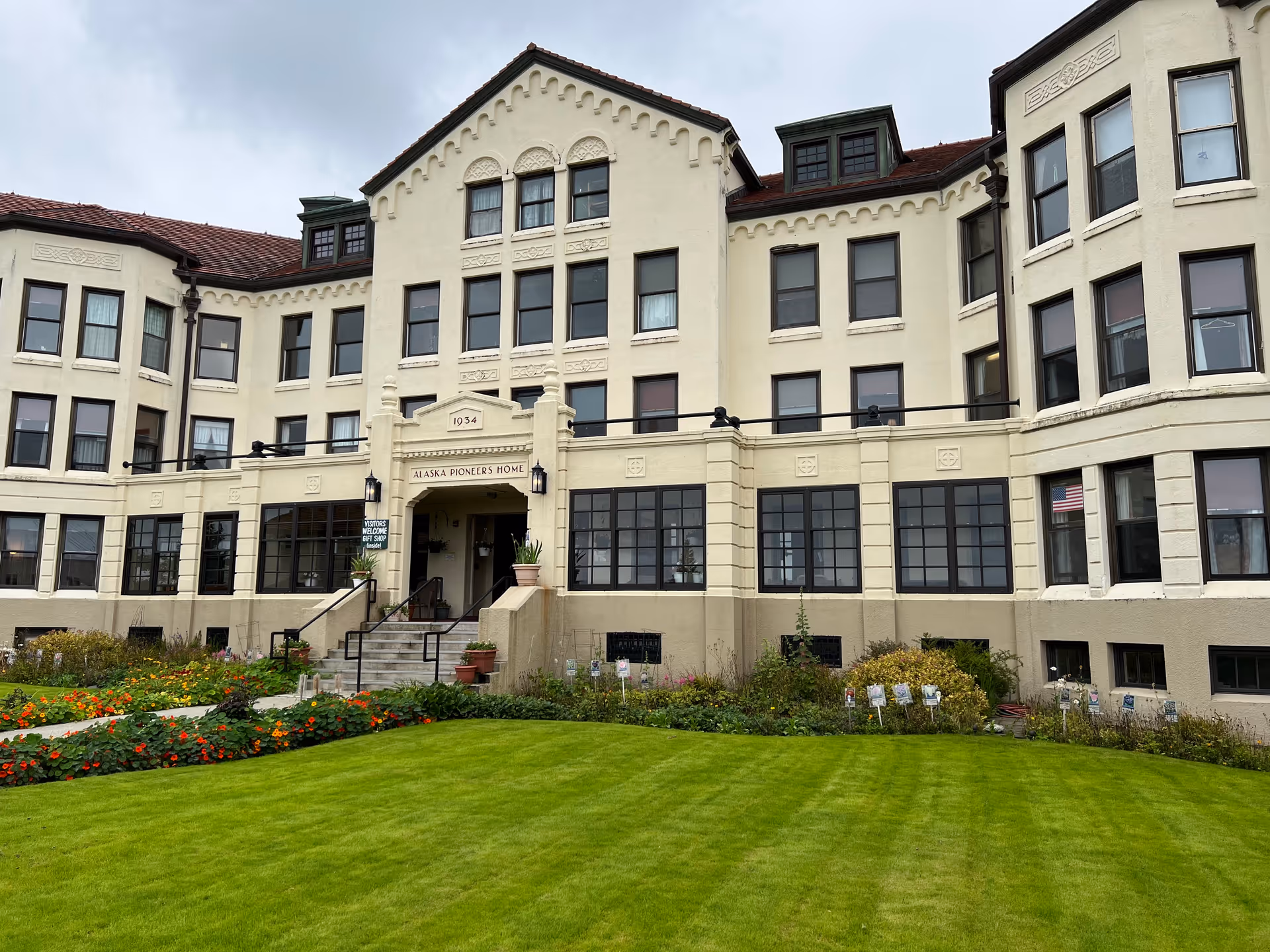 Exterior view of Pioneers' Home Sitka senior living building with a manicured lawn.