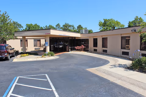 Exterior view of Arcadia Health and Rehabilitation Center entrance with curved driveway.