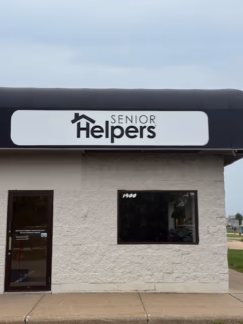 Exterior view of a Senior Helpers building with a large entrance sign.