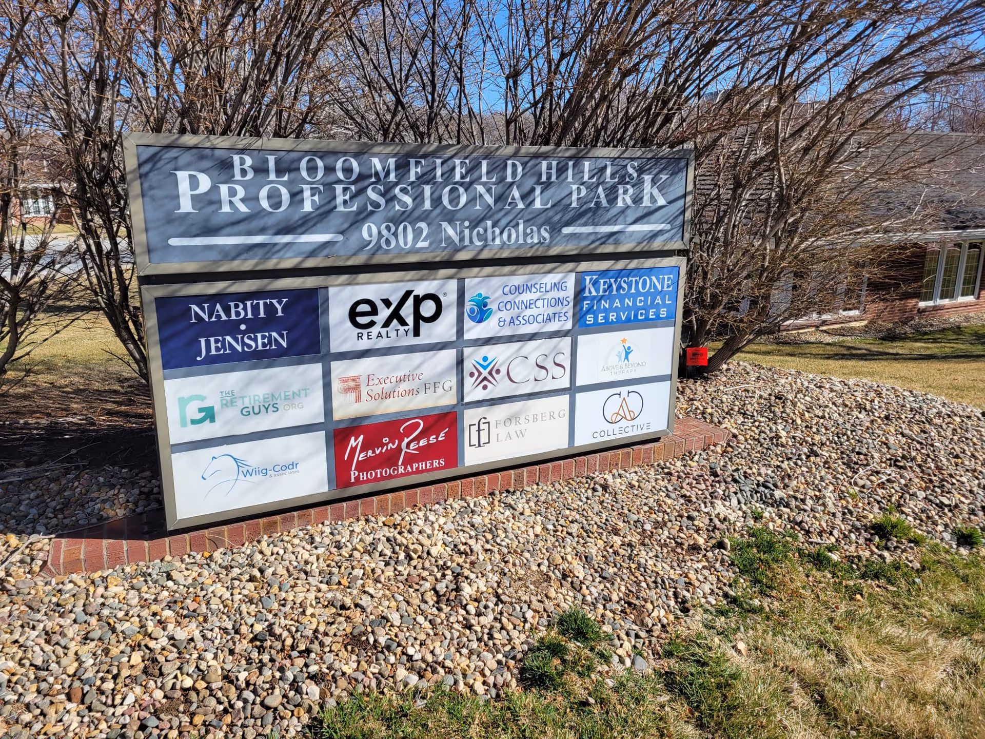 Outdoor signboard displaying multiple logos for Bloomfield Hills Professional Park.