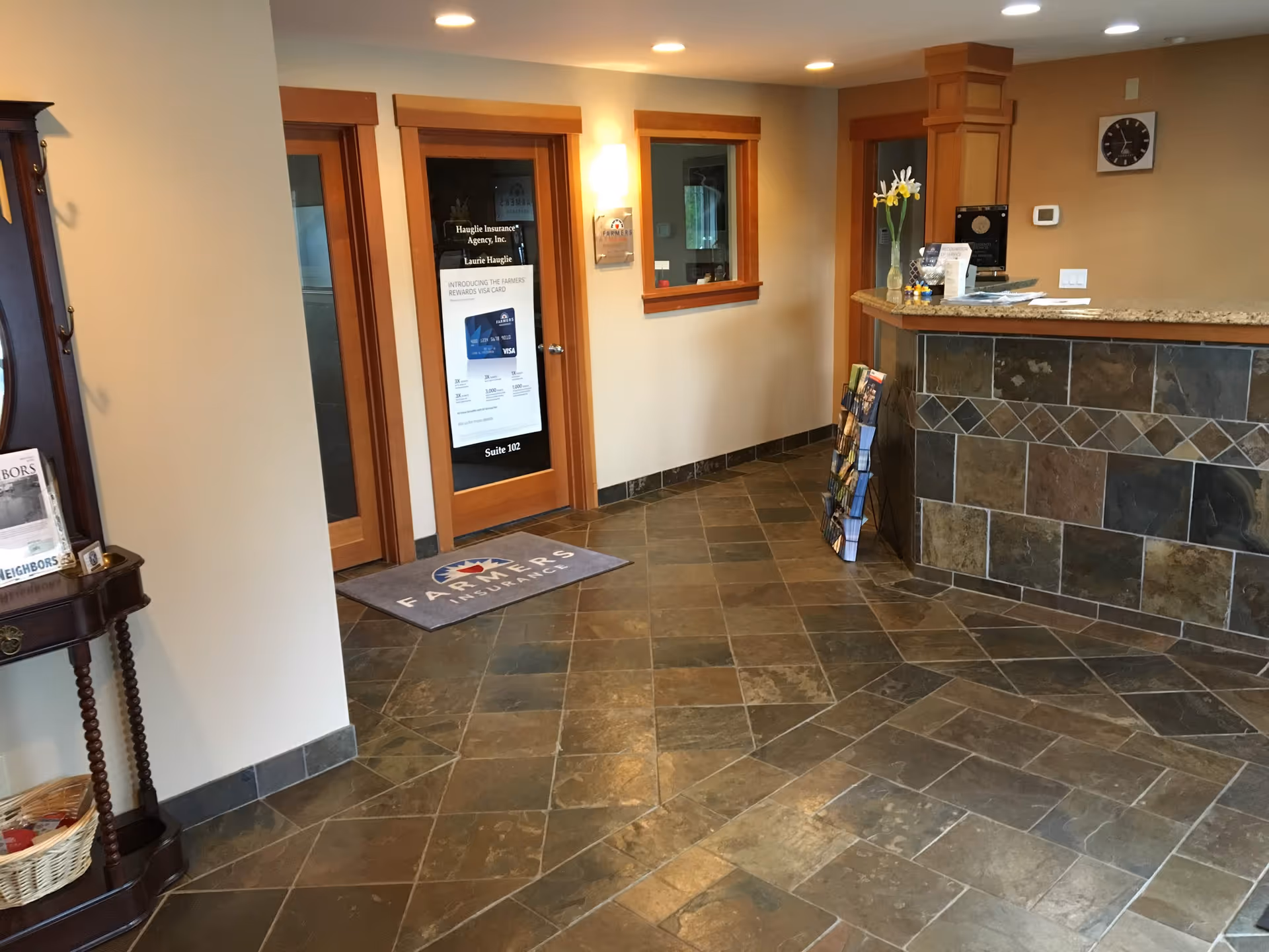 Interior lobby of Visiting Angels Maple Valley with front desk and tiled floor.