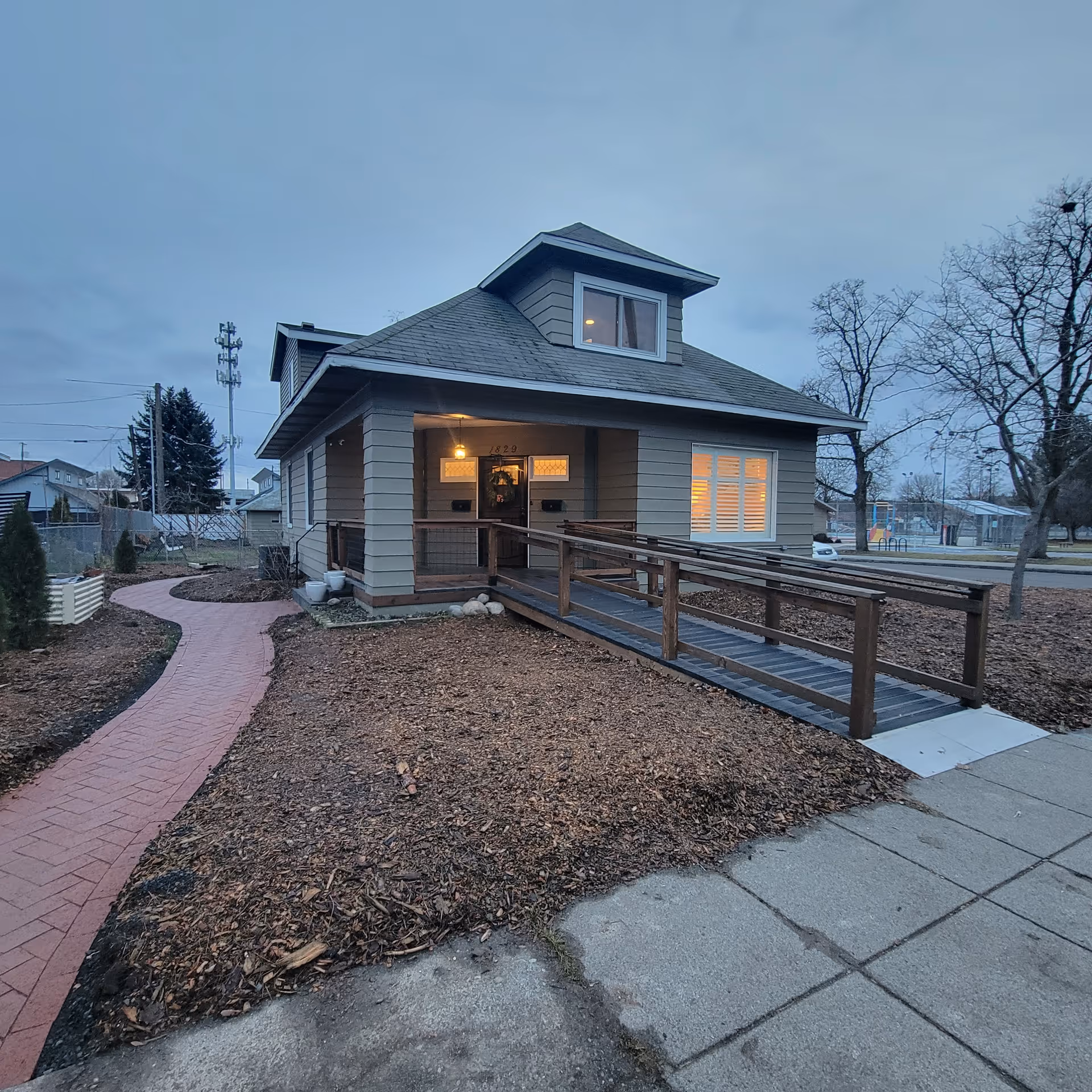 Front view of Cloverstone Adult Family Home LLC building with ramp and walkway