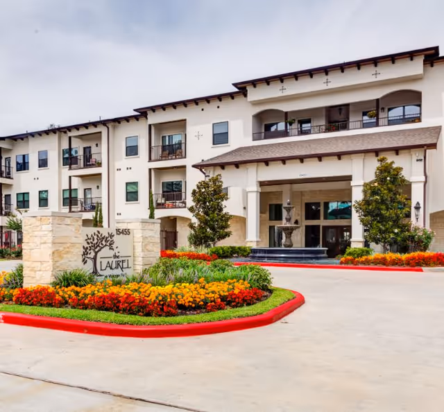 Exterior view of The Laurel at Vintage Park, featuring landscaped entry drive.