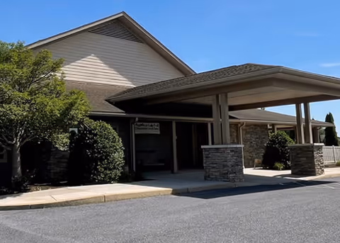 Exterior view of Albright LIFE Franklin facility with a covered entrance and landscaping.