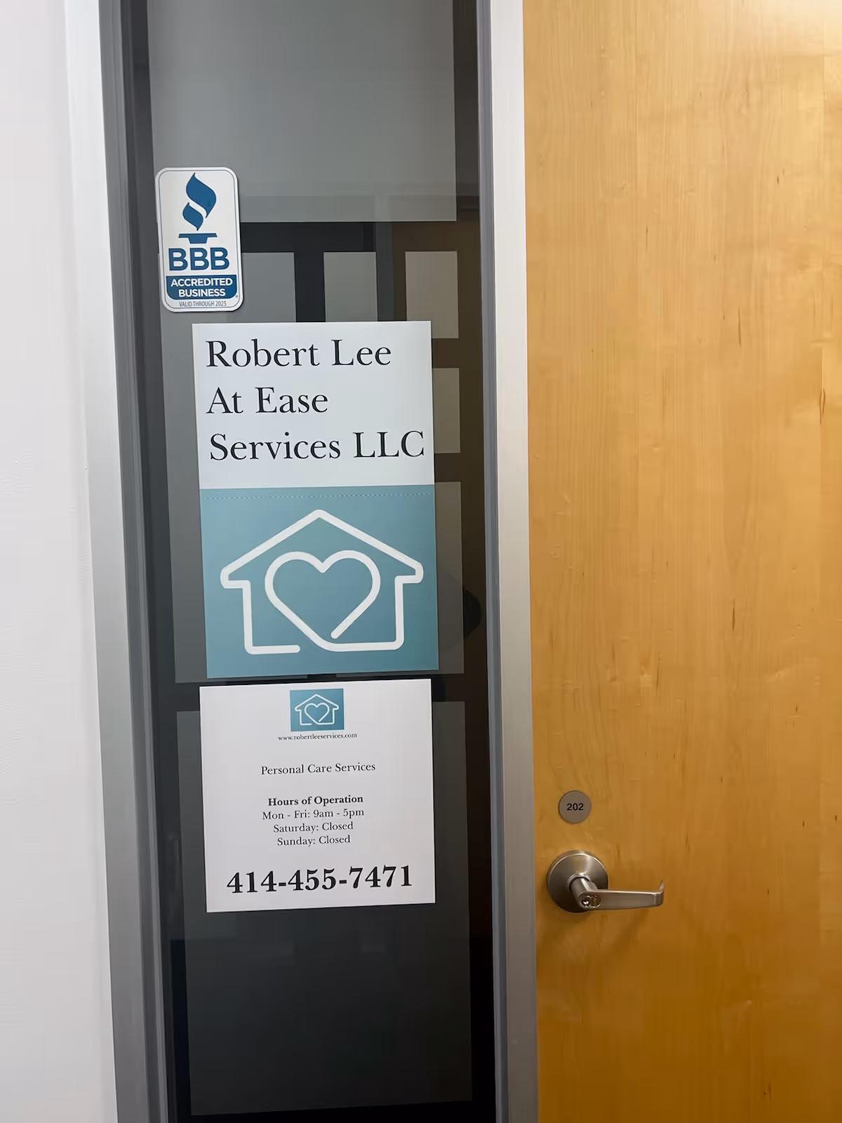 Door displays Robert Lee At Ease Services LLC sign with BBB sticker.