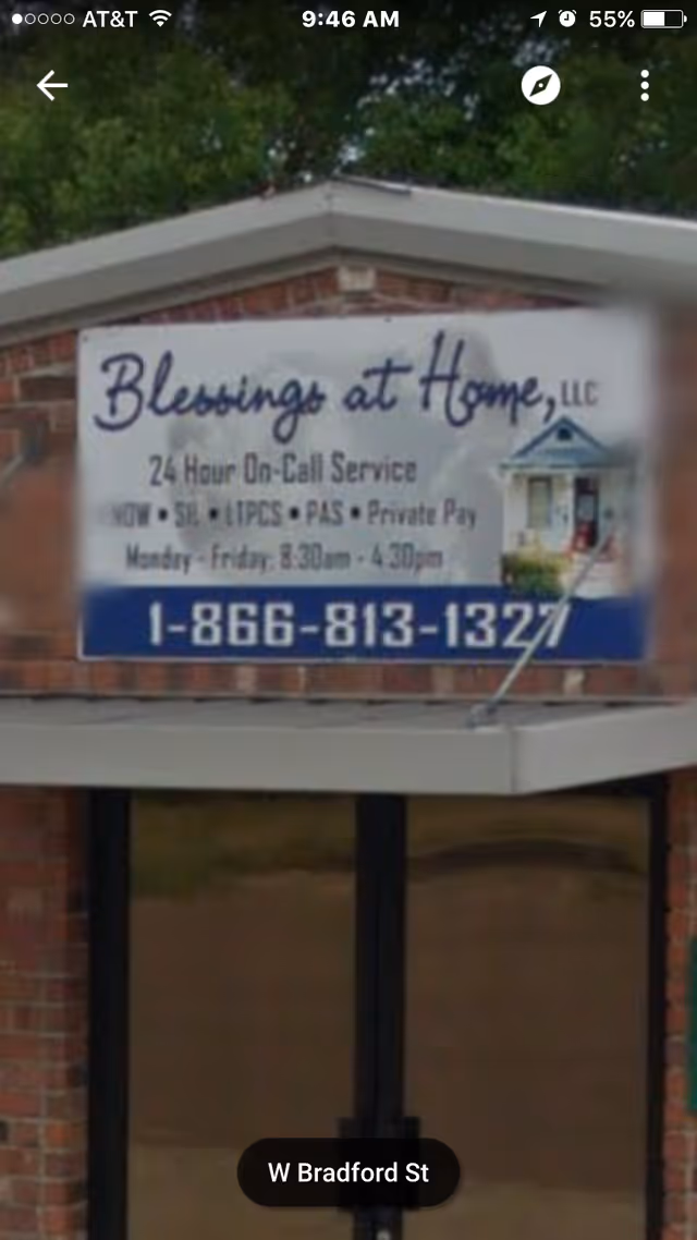 Exterior sign for Blessings at Home, LLC on a brick building.