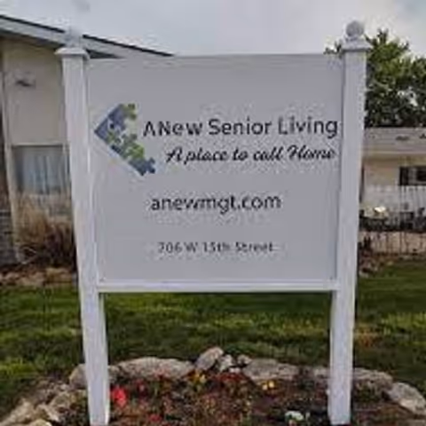 Outdoor sign for a senior living community in front of a building