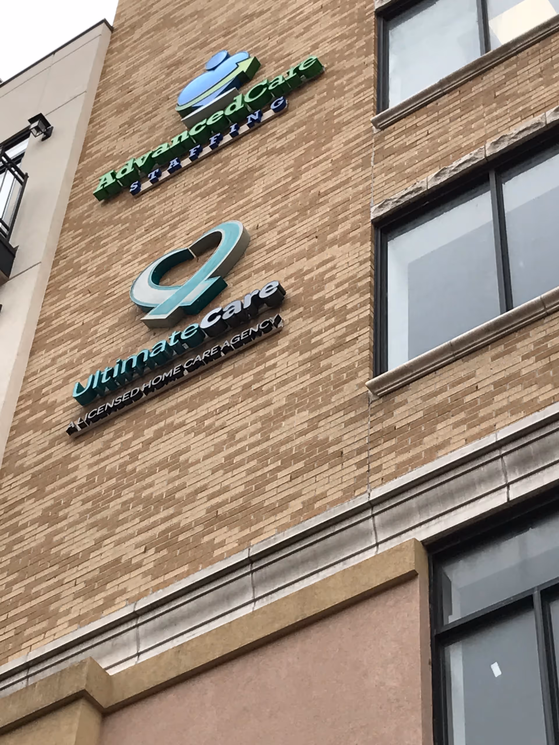 Brick building exterior displaying Ultimate Care NY signage on a brick facade.