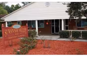 Front view of Suwannee Valley Nursing Center entrance with red mulch
