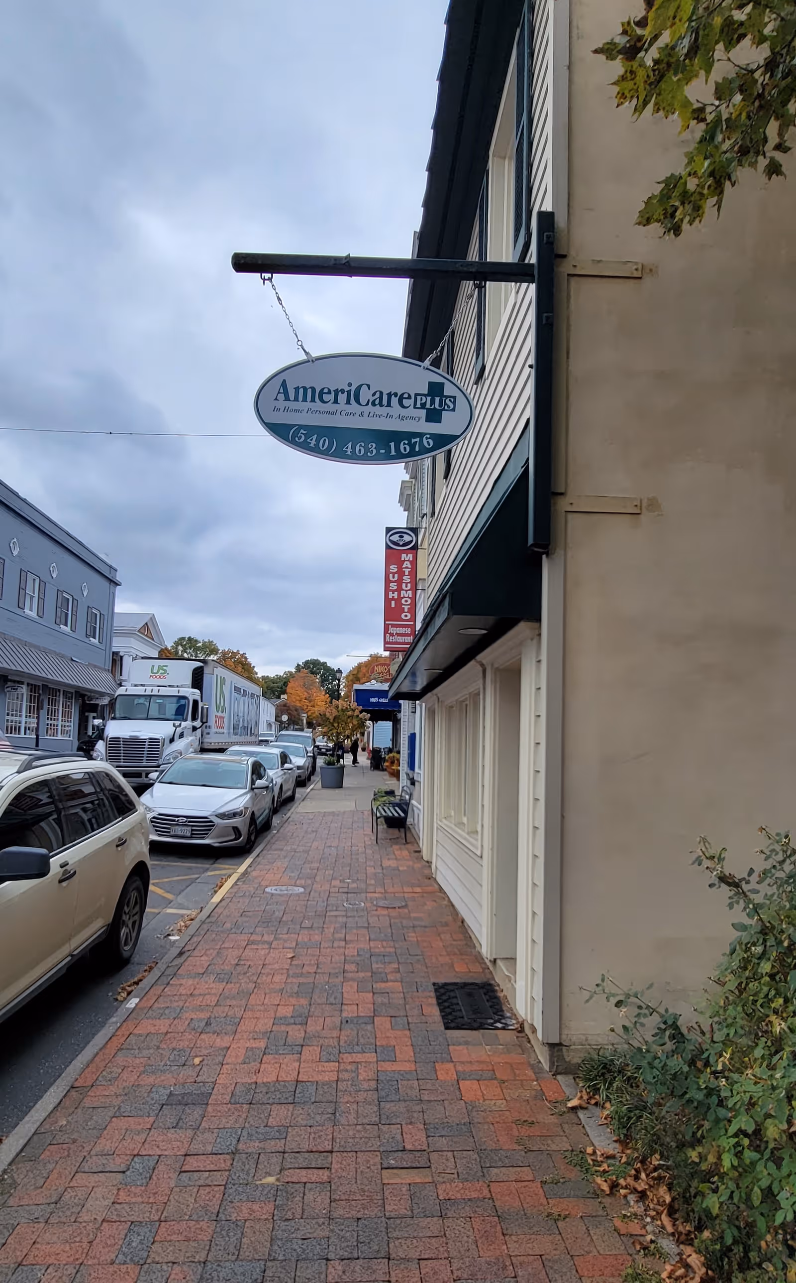 Exterior street view showing AmeriCare Plus Home Care Lexington sign on building.