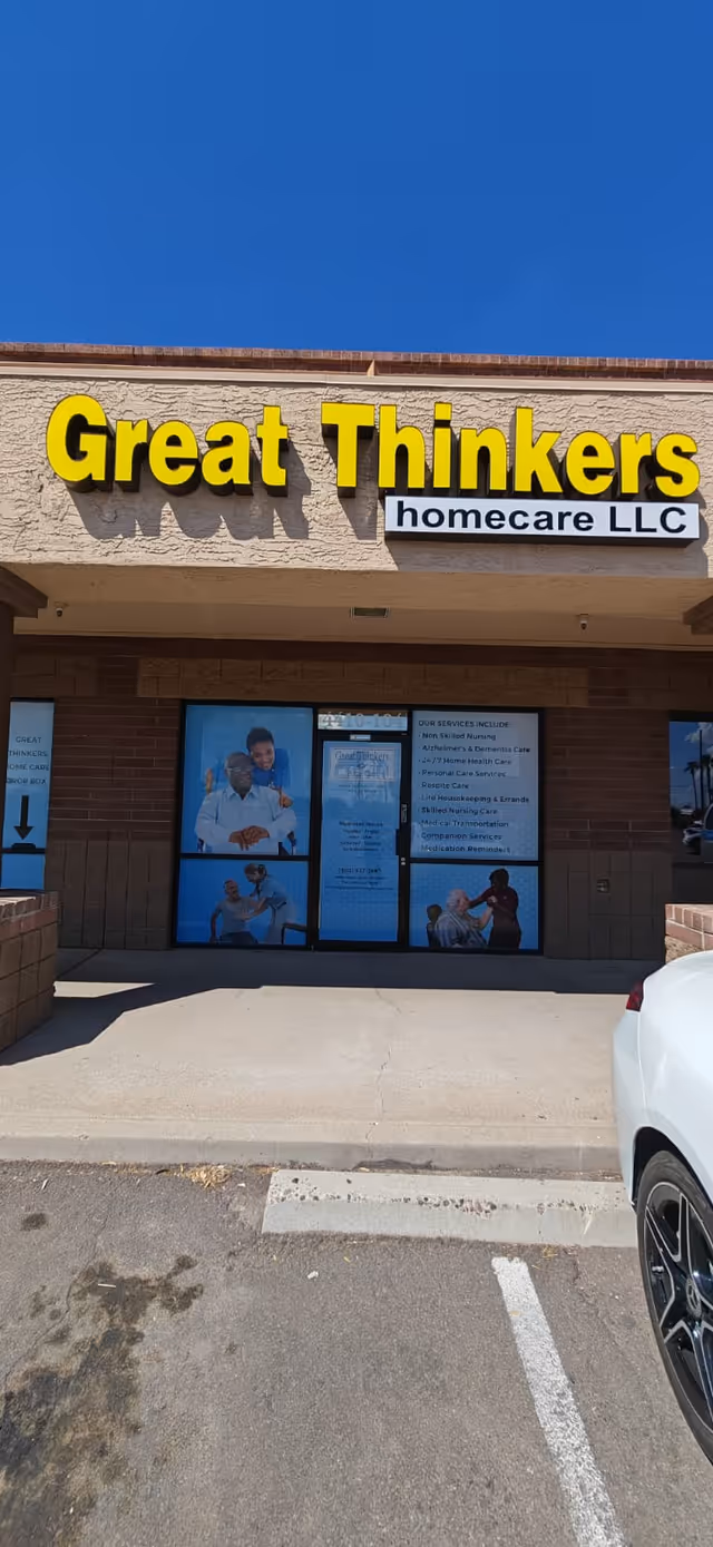 Front entrance of Great Thinkers Homecare LLC with large yellow signage and glass doors.