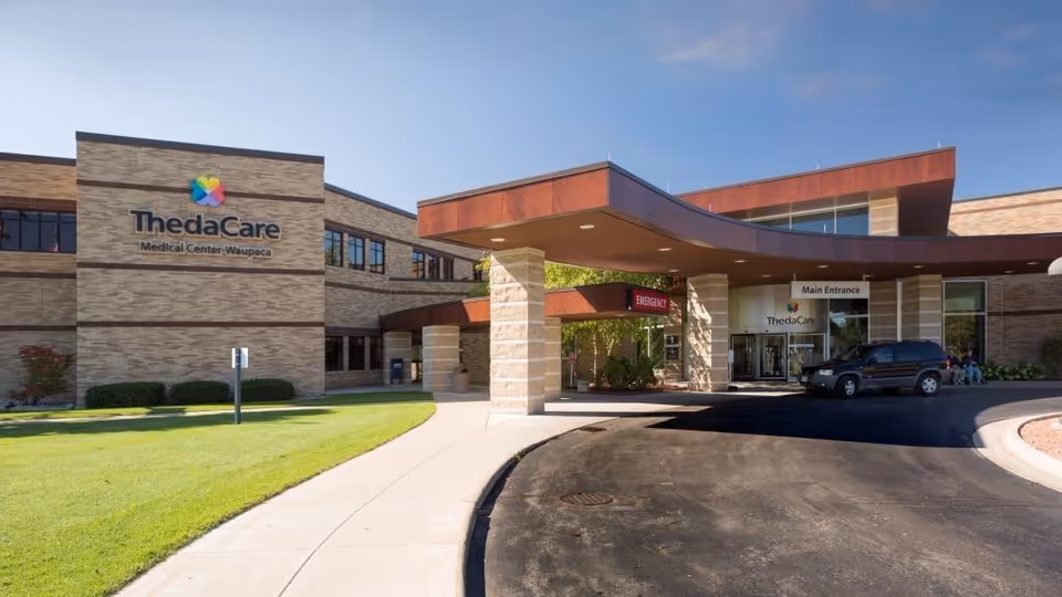 Exterior view of ThedaCare Medical Center-Waupaca with curved entrance canopy.
