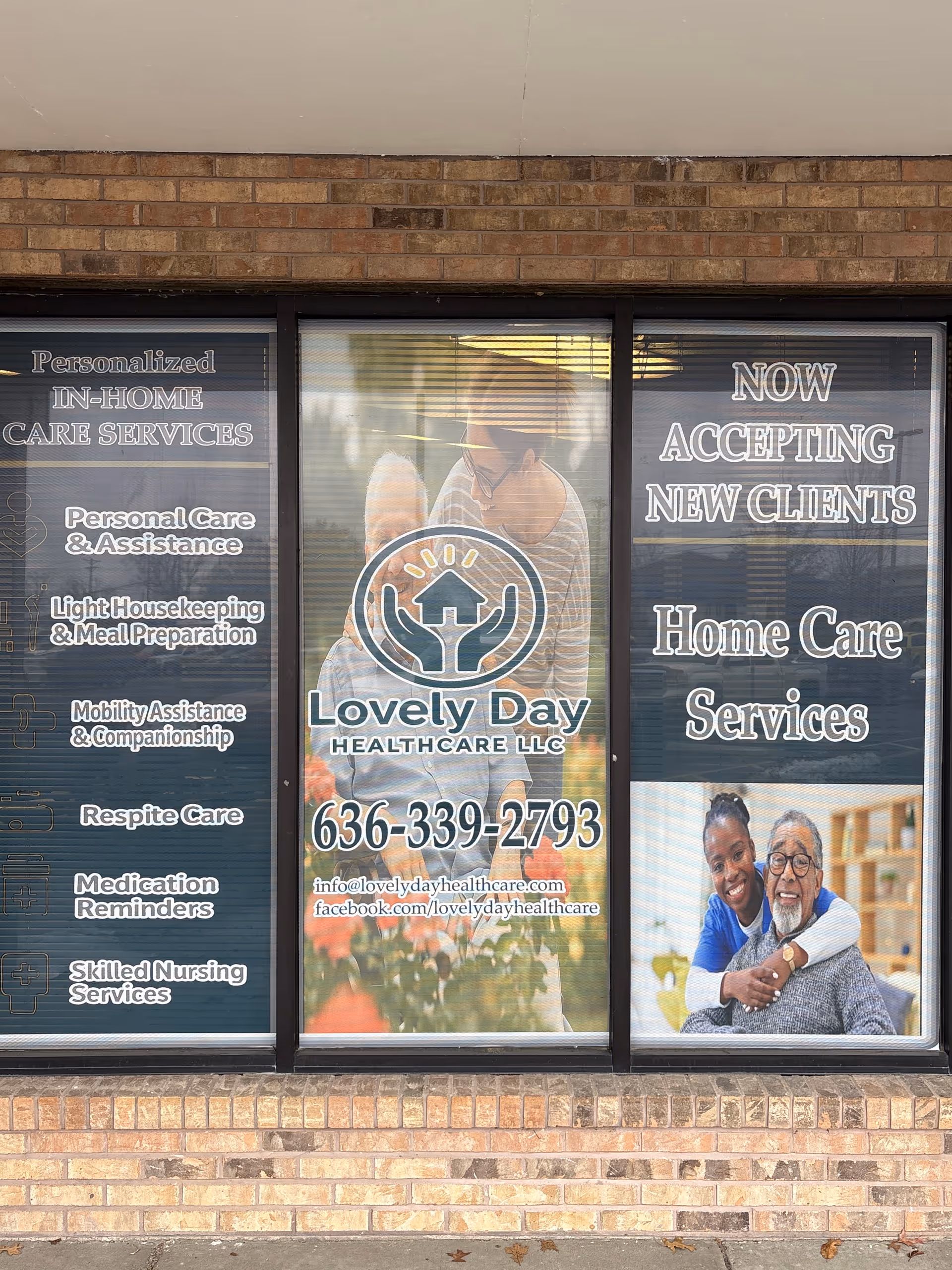Storefront window advertisement for Lovely Day Healthcare LLC displaying services and contact number.