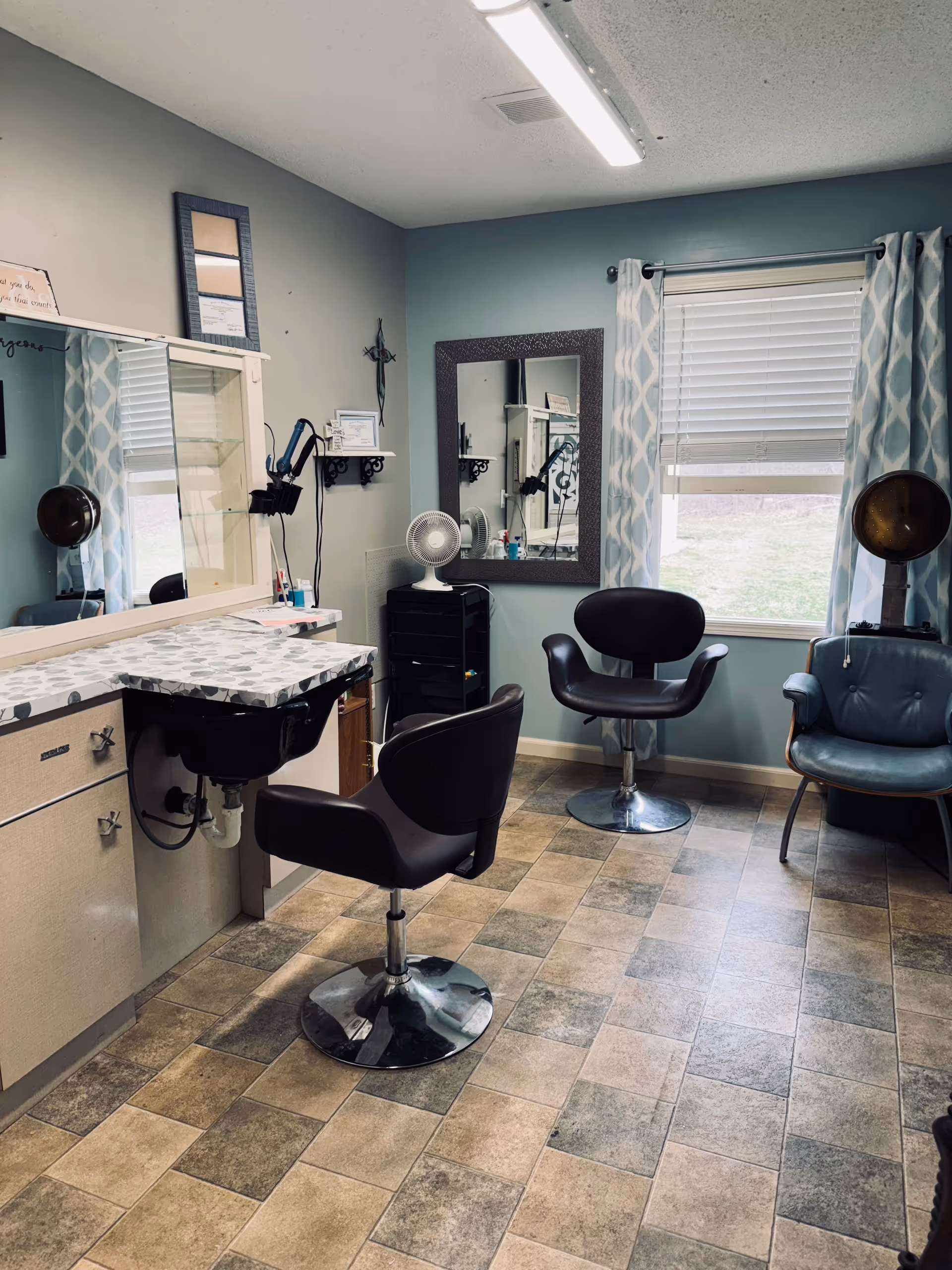 A hair salon inside Heritage Village with chairs, mirrors, and styling stations.