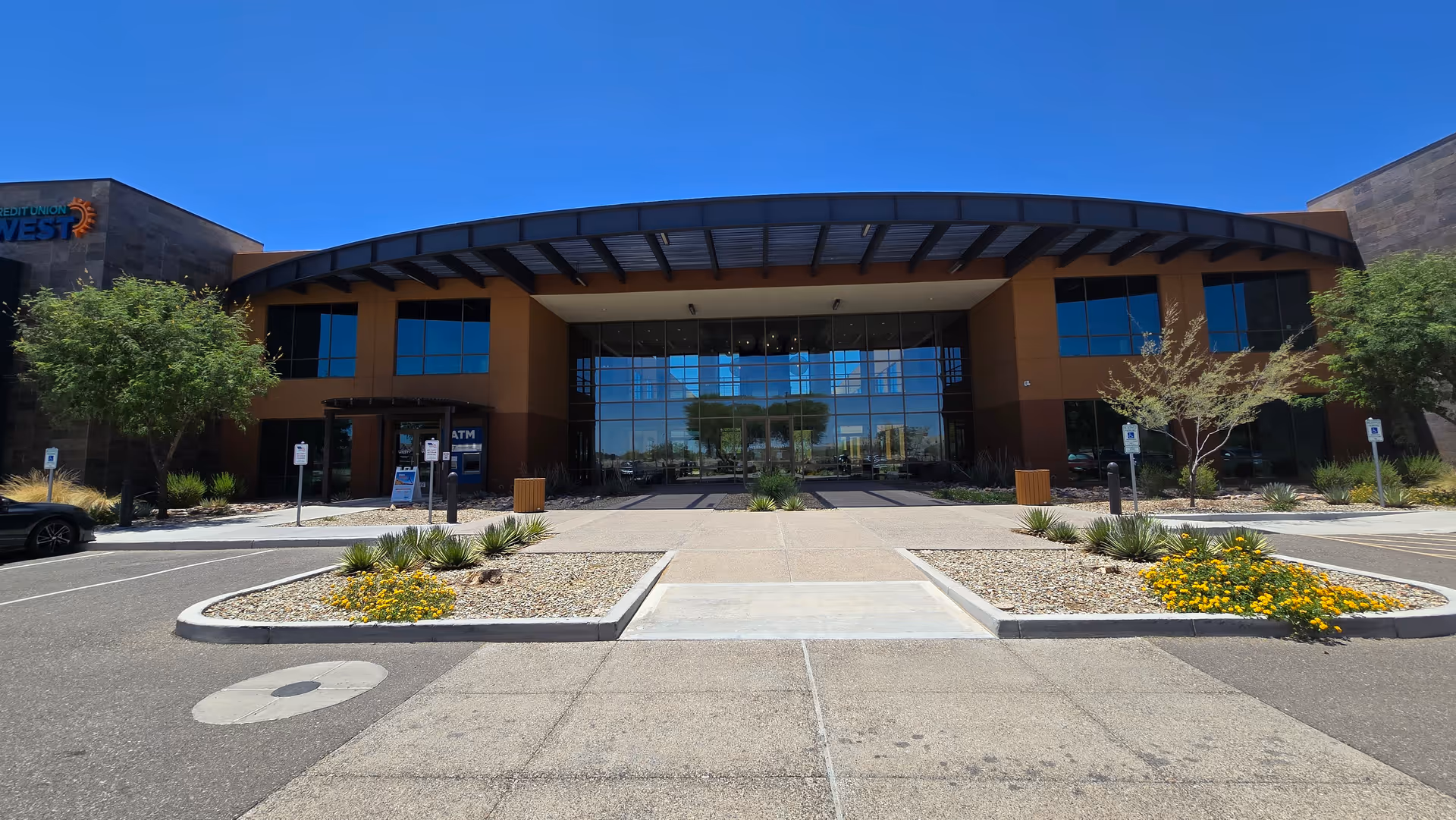 Canyon Home Care and Hospice building front with glass entrance and landscaped parking.