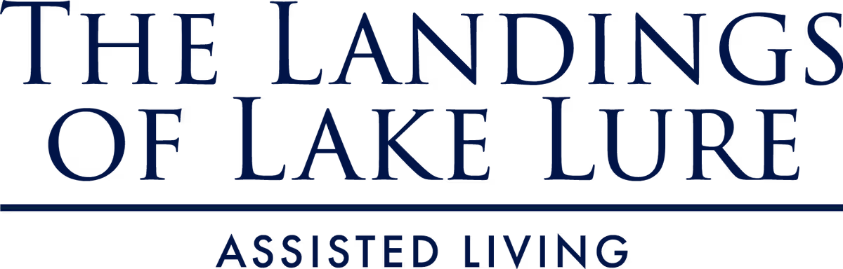 Sign reads The Landings of Lake Lure Assisted Living on a dark background.