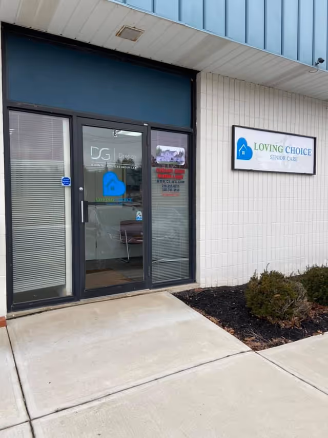 Exterior view of a facility entrance with a Loving Choice Senior Care sign