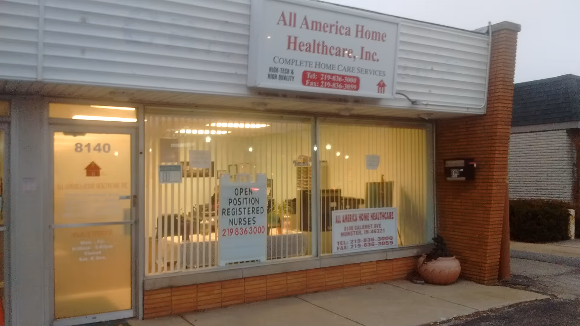 Front of a storefront for All America Home Health Care with large glass windows
