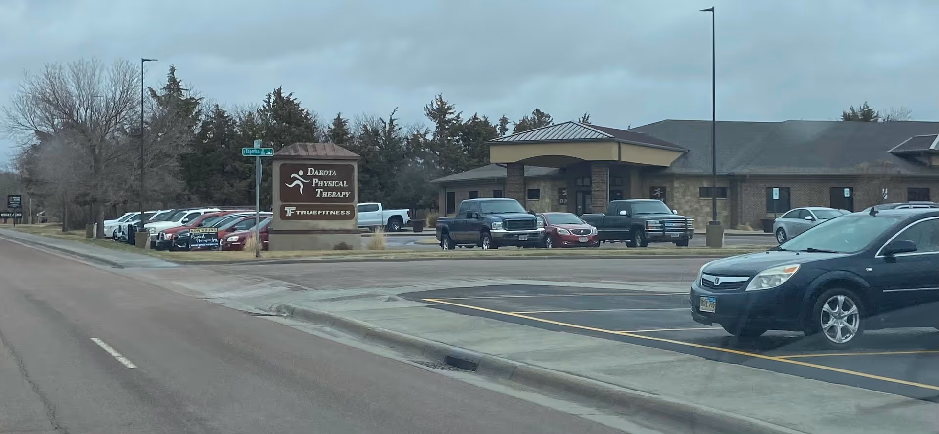 Dakota Physical Therapy building with parking lot along a suburban road