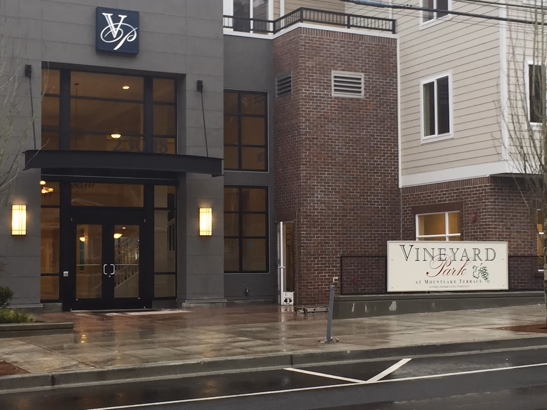 Front facade of Vineyard Park at Mountlake Terrace with glass doors and exterior signage.
