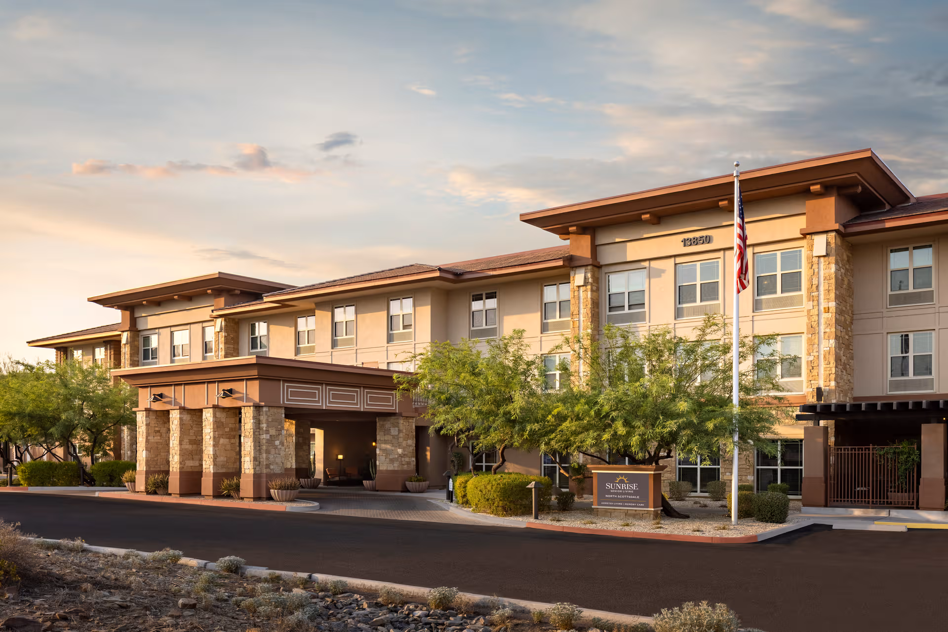 Exterior view of Belmont Village Senior Living Scottsdale with entrance canopy