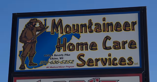 Outdoor sign reading Mountaineer Home Care Services LLC with a figure silhouette