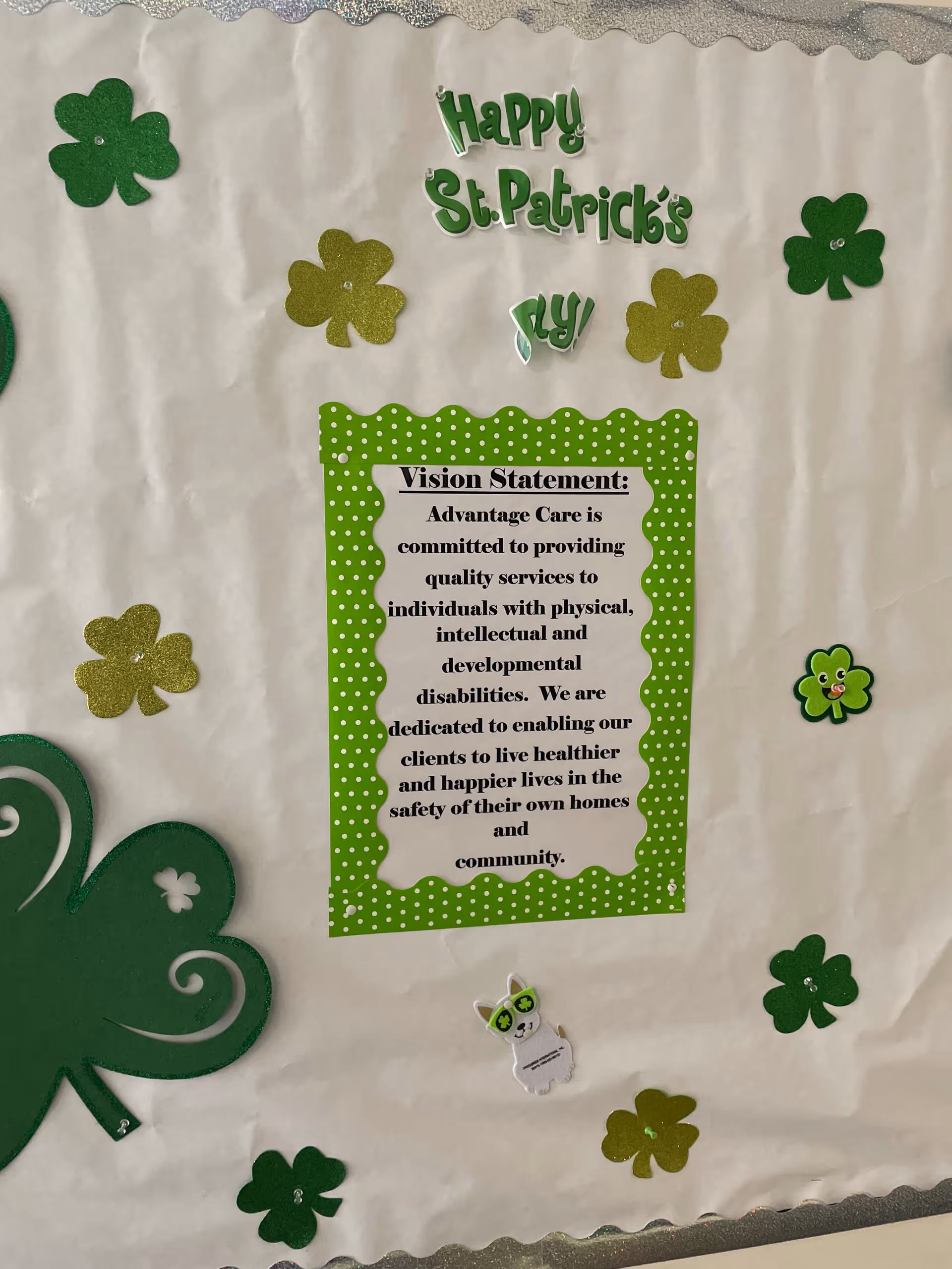 St. Patrick's Day bulletin board with a green polka-dot frame surrounding a vision statement.