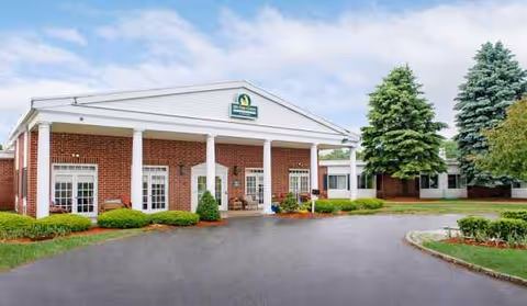Life Care Center of Nashoba Valley front entrance with brick facade and landscaping.