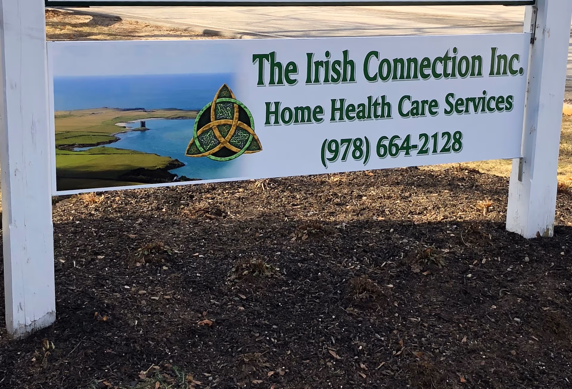Outdoor sign for The Irish Connection Inc. Home Health Care Services with landscape image.