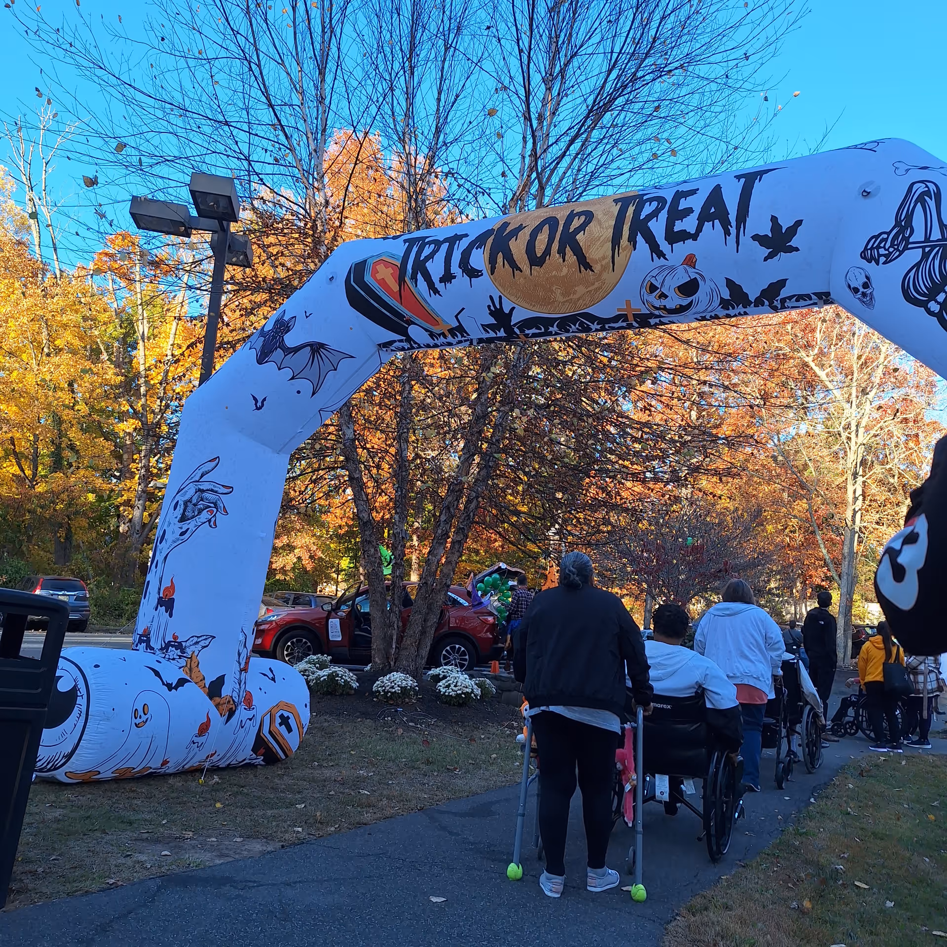 Outdoor Halloween event at Spring Grove Rehabilitation and Healthcare Center with Trick-or-Treat arch.