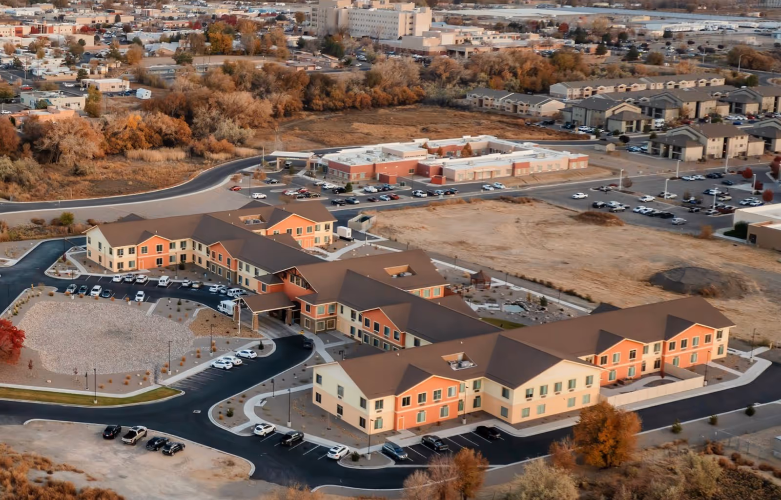 Aerial view of Three Rivers Estates Senior Living and Memory Care with interconnected buildings.