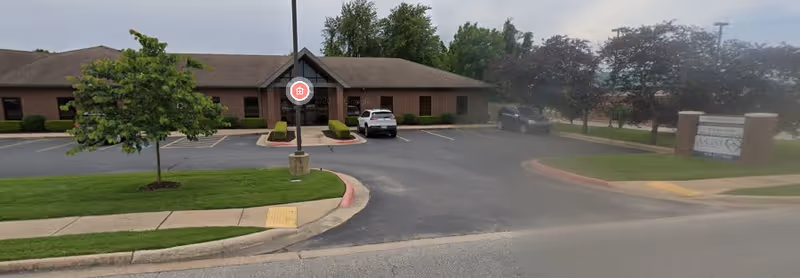 Exterior view of A-List Home Care, LLC building with parking lot and landscaping