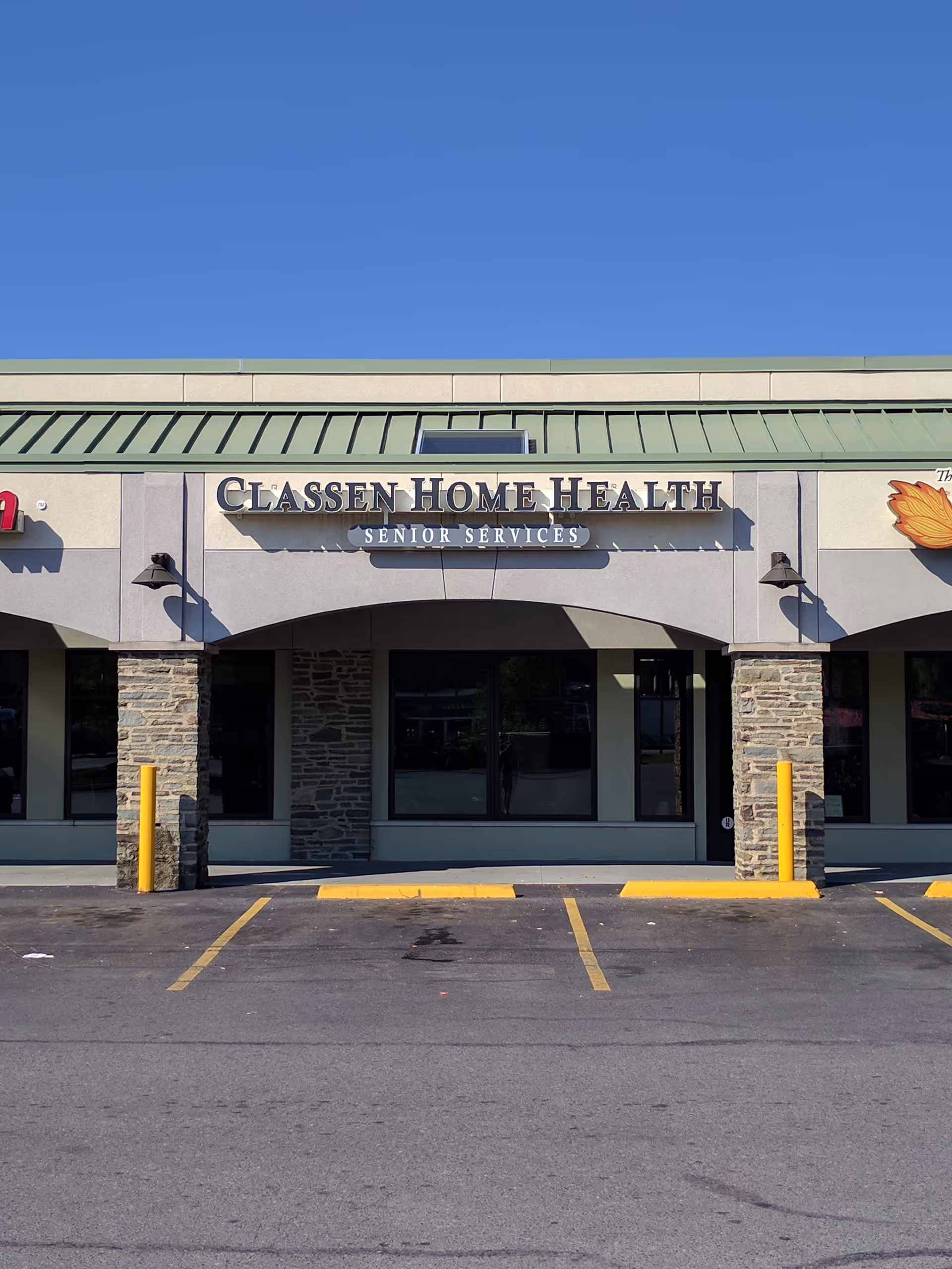 Front view of Classen Home Health building with parking lot in foreground.
