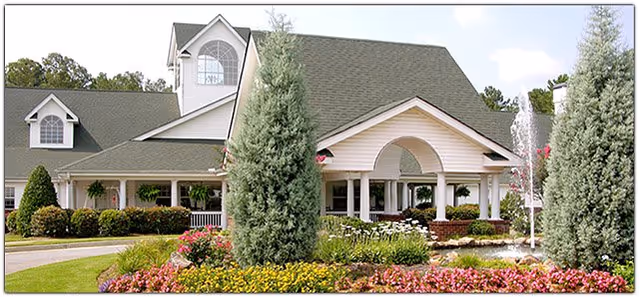 Front view of Riverside Presbyterian House with landscaped entrance and fountain.